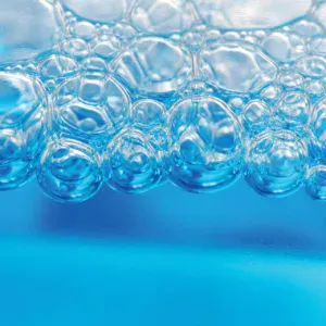 A cluster of clear bubbles against a blue background